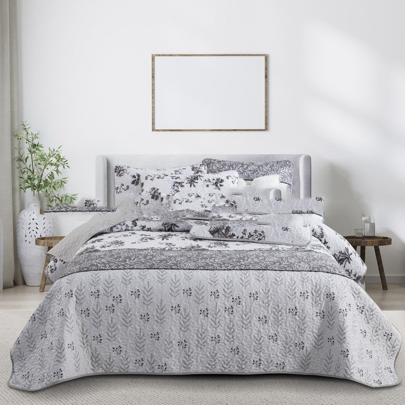 Bed with floral bedding in a bedroom setting