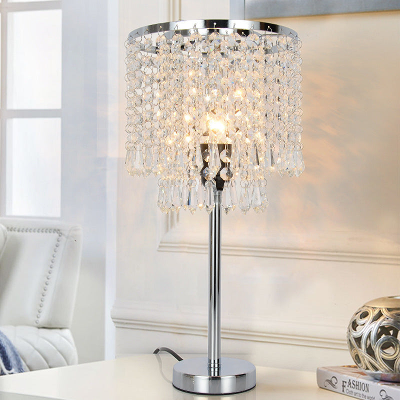 Elegant crystal table lamp with soft light, perfect for home décor.