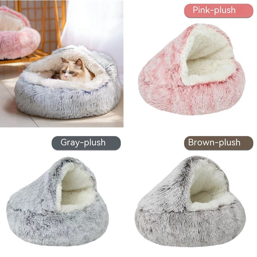 Plush pet beds in gray, pink, and brown with a cat inside one of them.