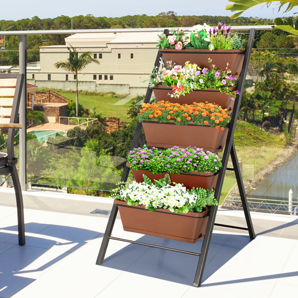five-tiered vertical garden with plants on a balcony